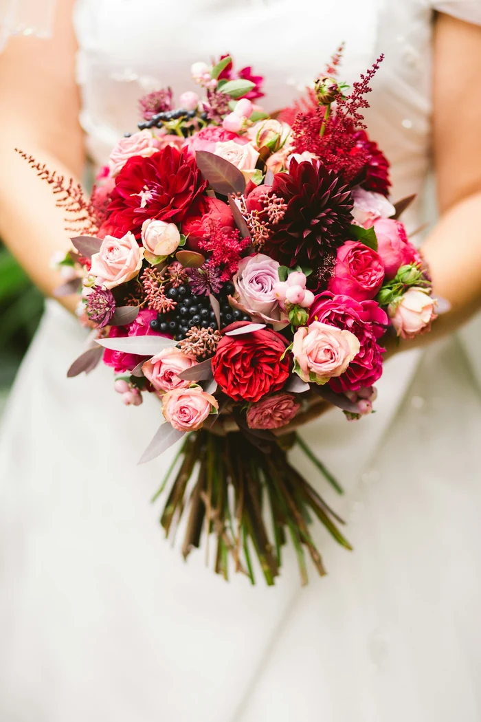 Wedding bouquet with cream, blush and burgundy flowers